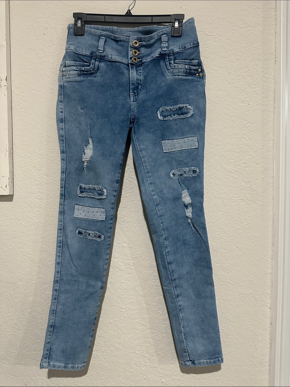 Mid-Rise Light Blue Distressed Skinny Jeans - Women's